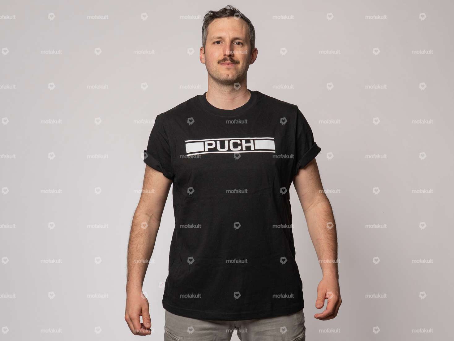 mk-Merch T-Shirt "PUCH" black Carousel Image 1